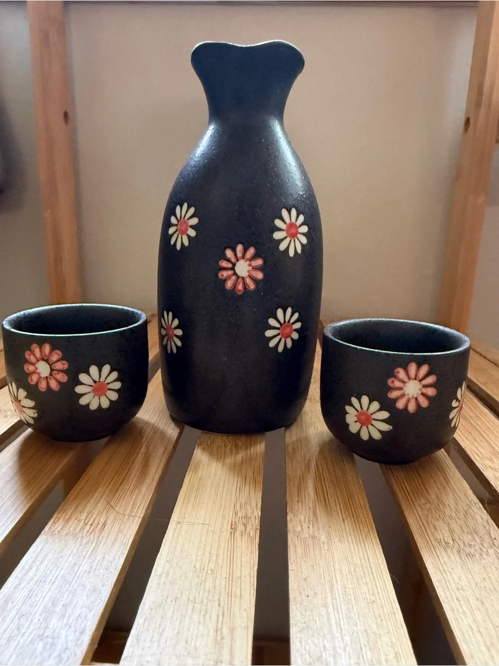 Black Ceramic Floral Sake Set with Pink and White Daisy Accents